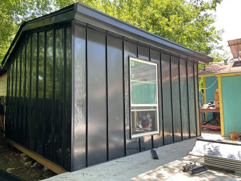 Black standing seam metal wall panels for Roof Inspection in Big Lake